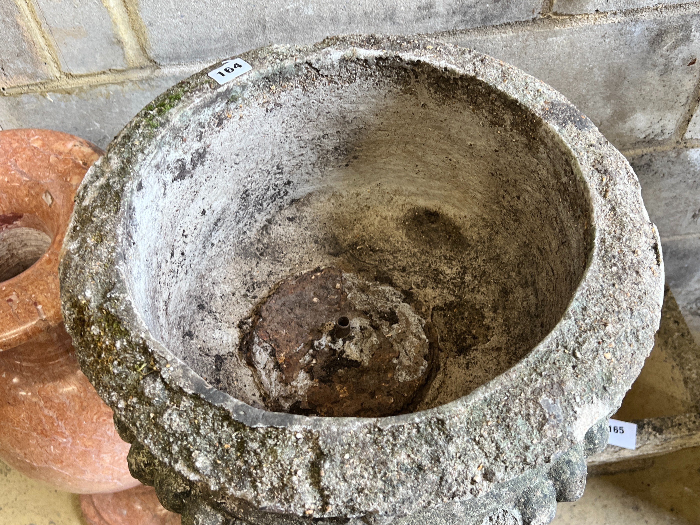 A reconstituted stone circular garden fountain, diameter 43cm, height 84cm